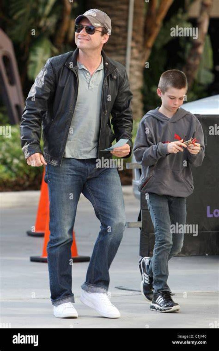 Christian Slater and his son Jaden, arrive for the first game of the