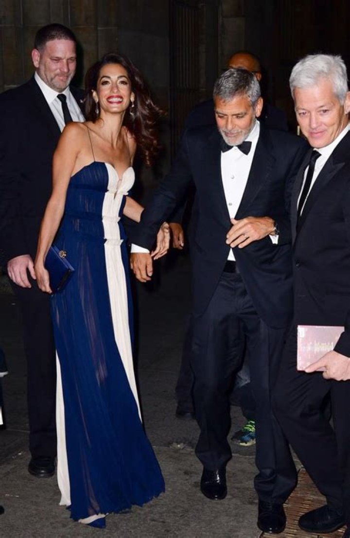 Clooney’s wife Amal juggles twins after UN awards gala Photos